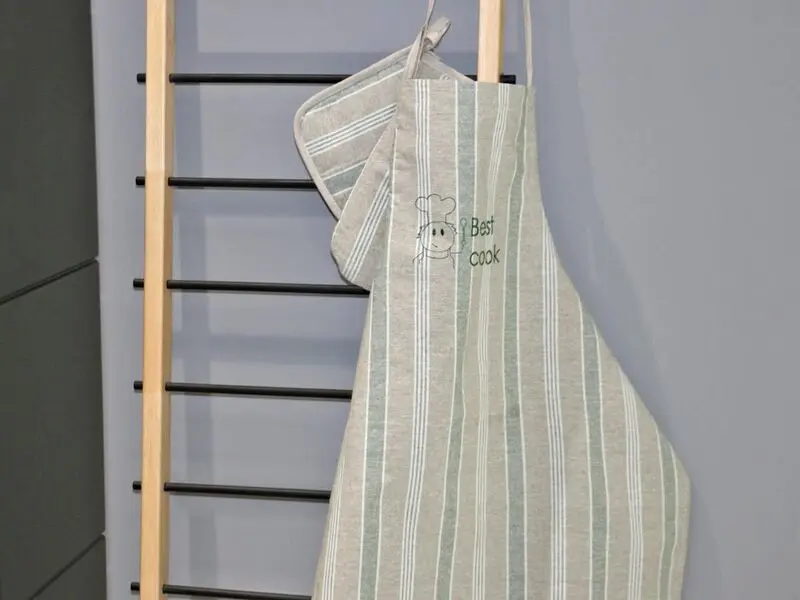green set of cotton apron with gloves and pot holder