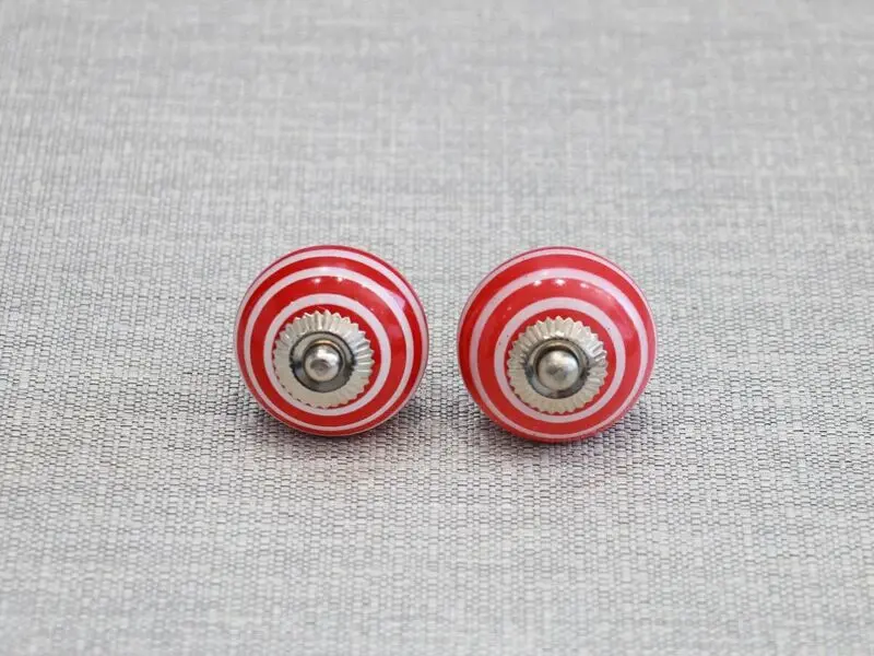 ceramic door knob with red circles