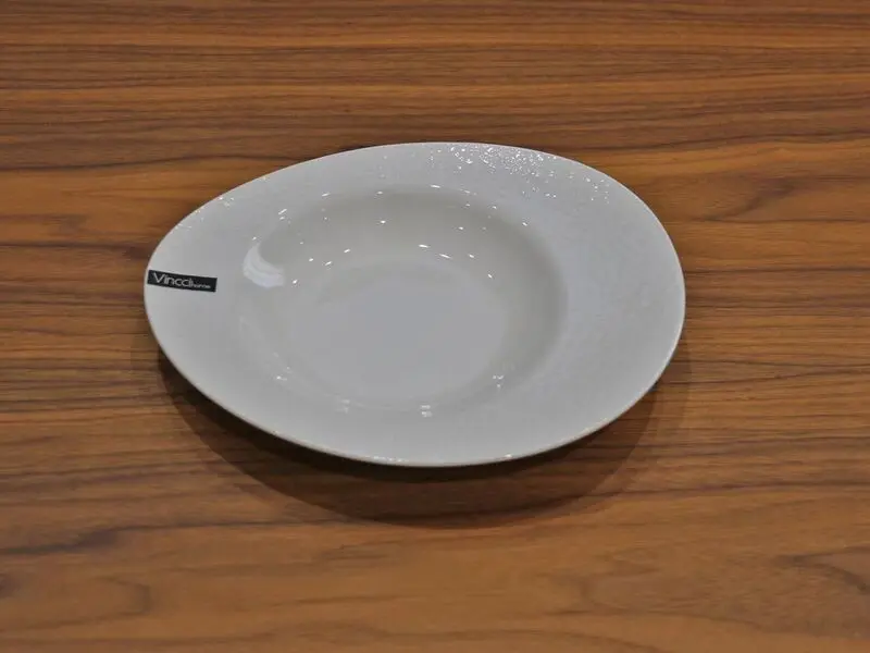white glossy soup plate with raised design 22cm