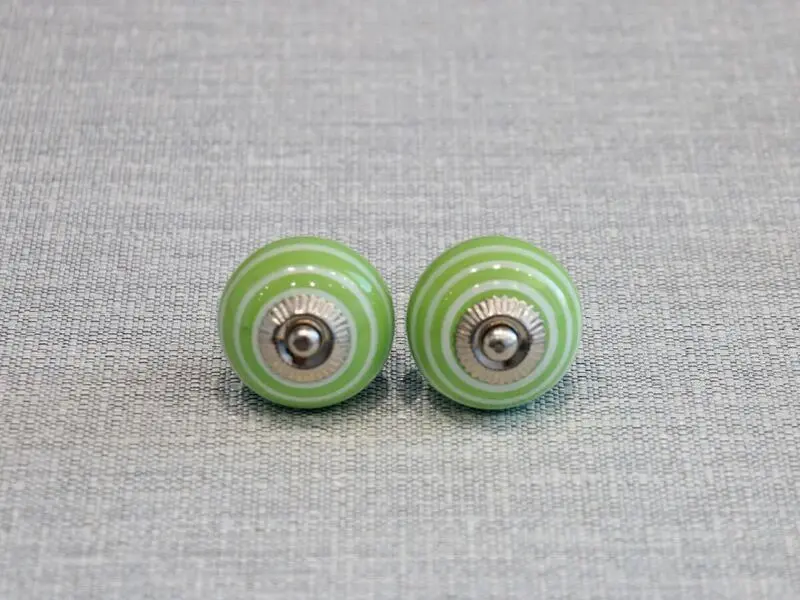 ceramic door knob with green circles