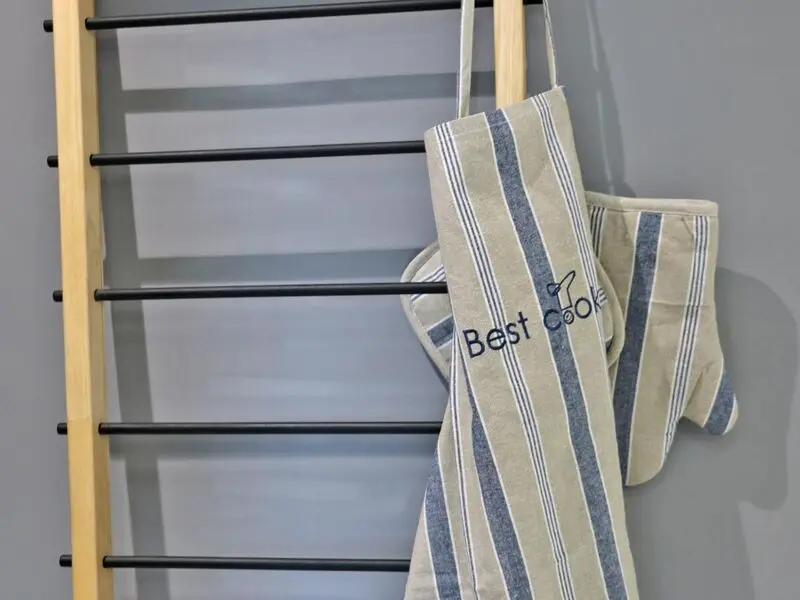 blue set of cotton apron with gloves and pot holder