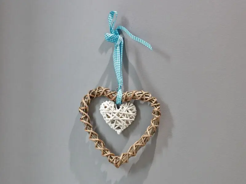 wooden and white heart with ribbon