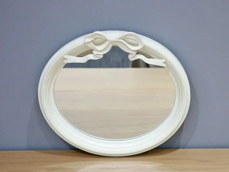 mirror with ribbon detail