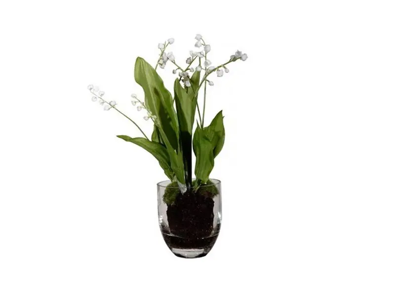 artificial plant in glass pot