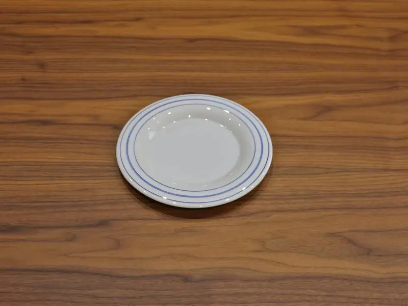 white plate with blue rim 23cm