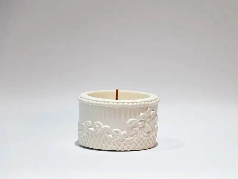 embossed pot design with candle