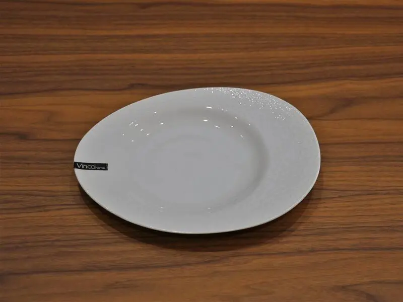 white glossy salad plate with raised design 21cm