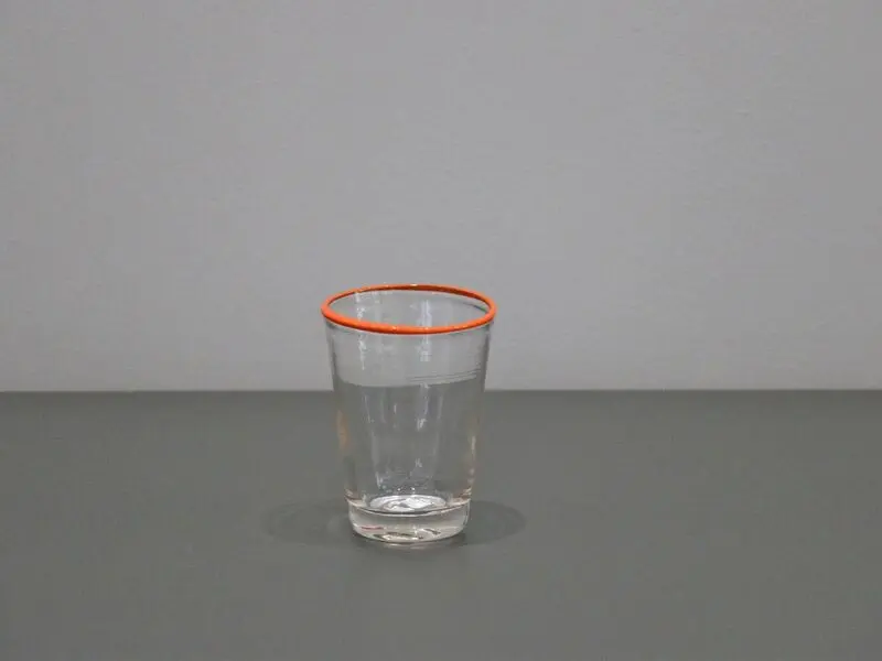 glass with orange rim