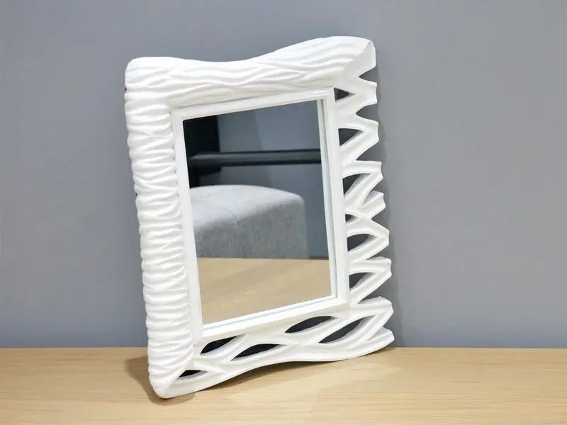 white frame mirror with wave design