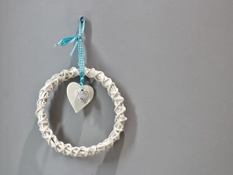 white ring with wooden and silver hearts