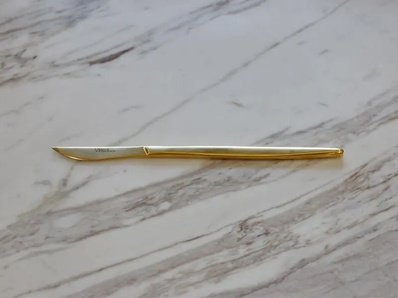 golden stainless steel table knife with matte finish