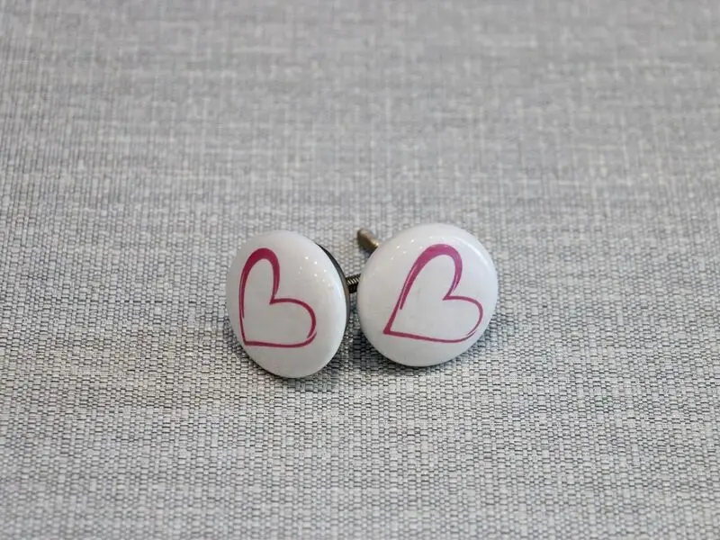 ceramic door knob with pink heart