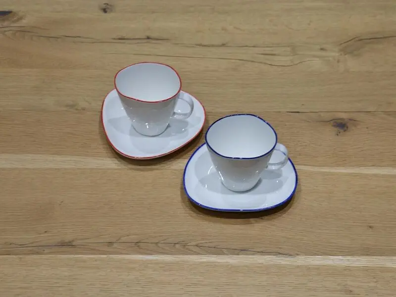 porcelain cup and saucer with blue rim