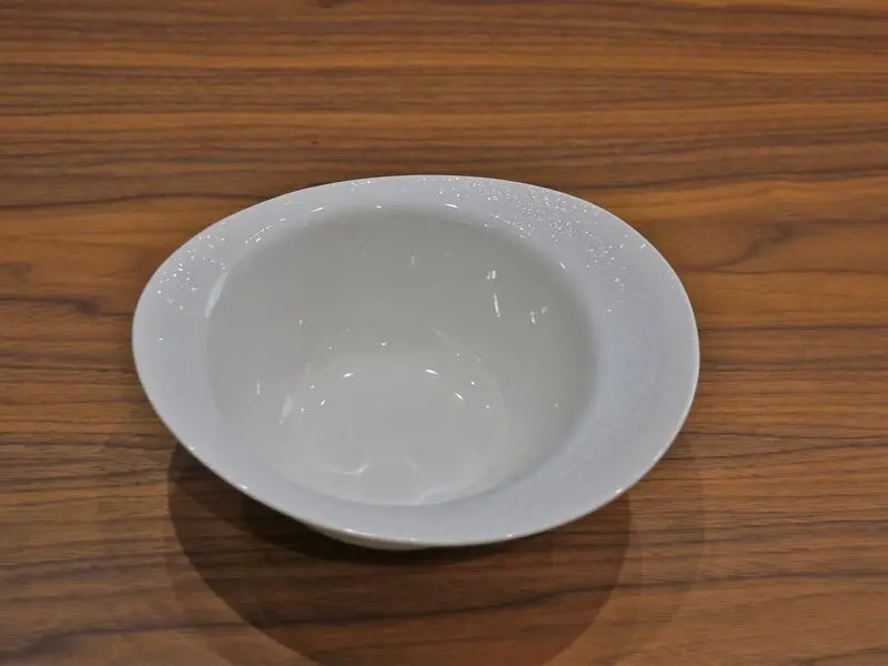 white glossy bowl with raised design 20cm