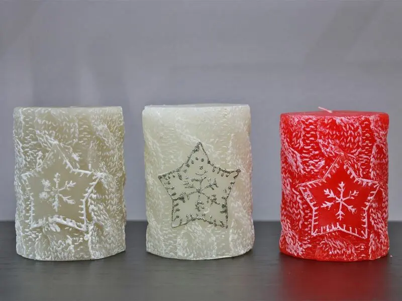 red candle with snowflake