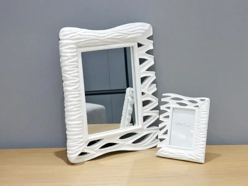 white frame mirror with wave design