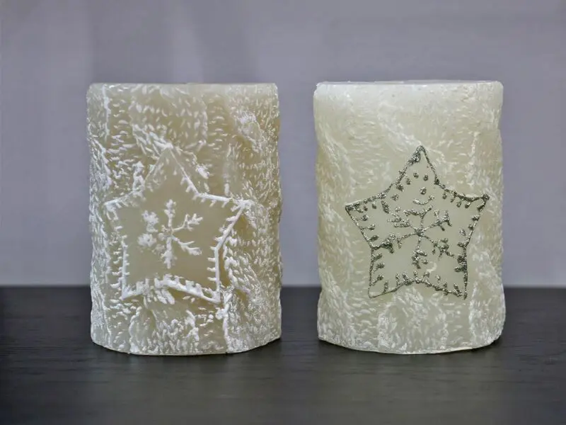 white candle with snowflake