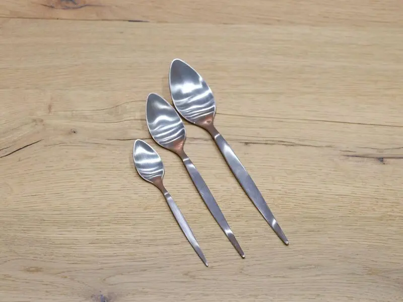 matte silver-colored stainless steel table spoon