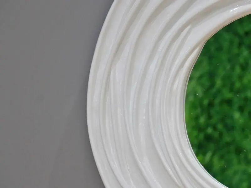 glossy white round mirror