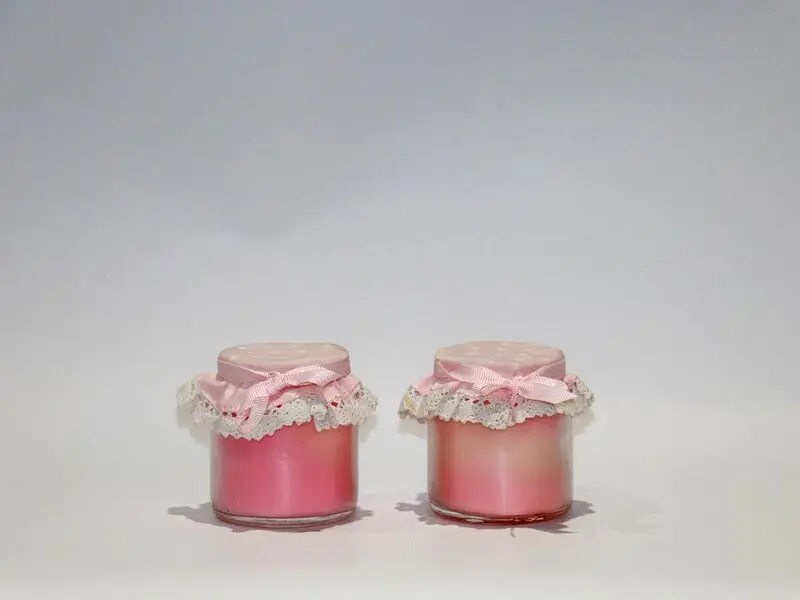 scented pink candles in jars