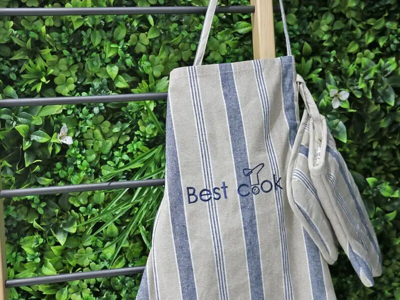 blue set of cotton apron with gloves and pot holder