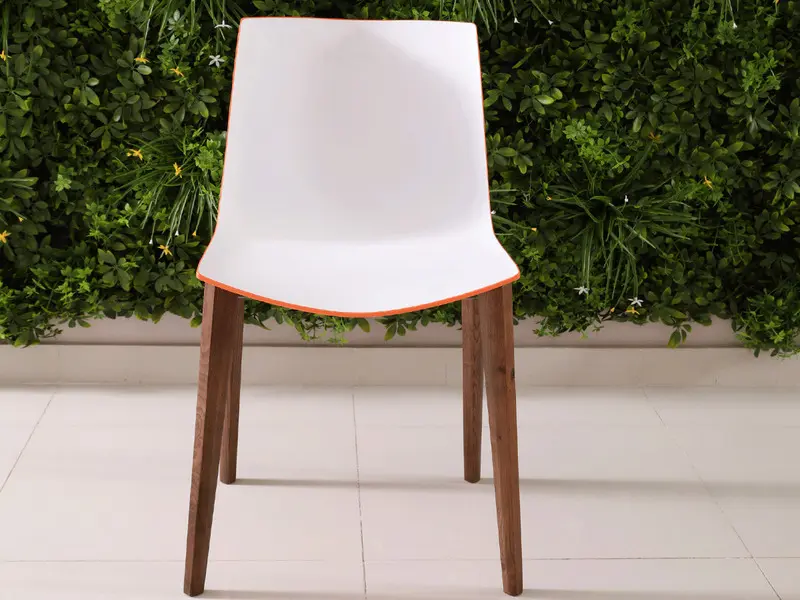 white orange chair in dark brown ash legs