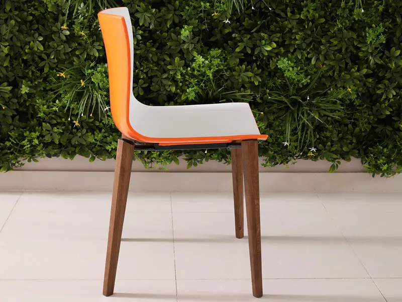 white orange chair in dark brown ash legs