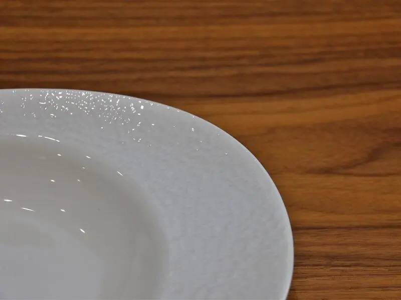 white glossy dinner plate with raised design 27cm