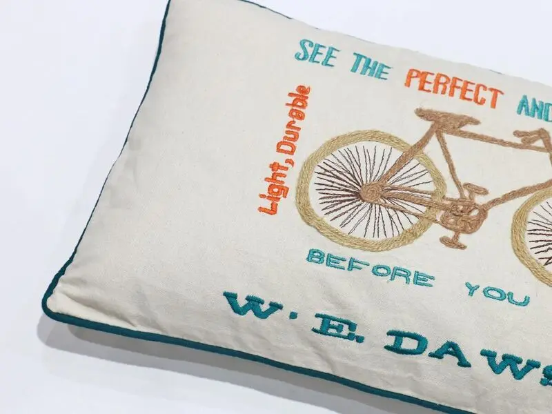 bycicle design cushion with petrol border 30x50 cm