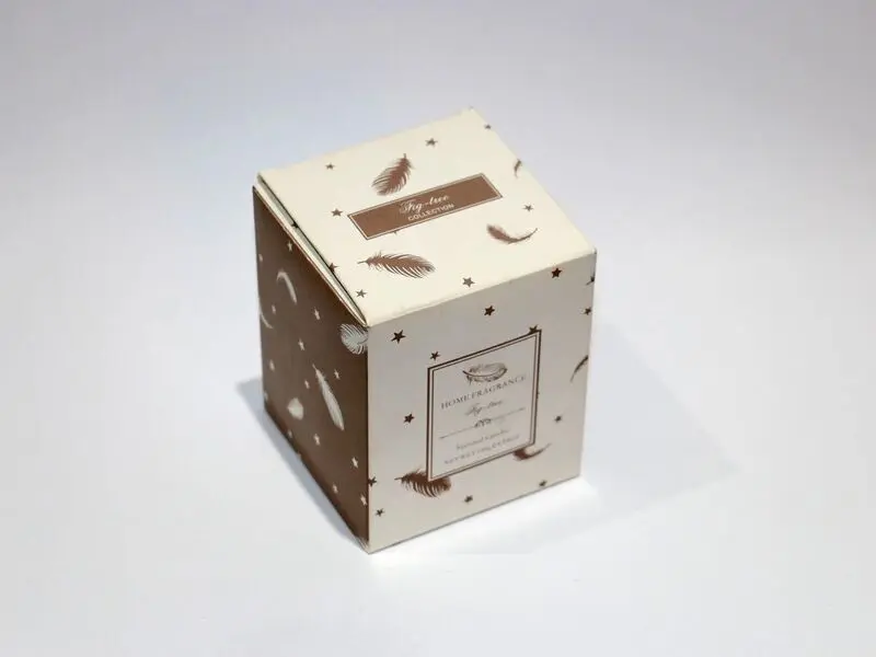 scented brown candle in glass